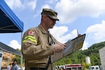 Technical Sgt. Robert Laidlow, 167th Fire and Emergency Services, monitors and keeps account of the firefighters assigned to his team during collapsed structure training as part of Exercise Vigilant Guard 2021 Aug. 27, 2021.