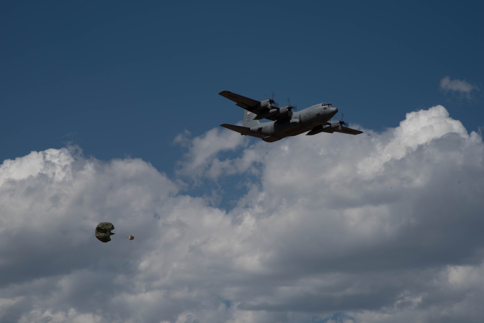 A C-130H Hercules aircraft with the 94th Airlift Wing, Dobbins Air Reserve Base, Georgia, drops cargo Sept. 14, 2021, at the Rifle Garfield County Airport, Colorado. Active-duty Air Force, Air National Guard and Reserve Citizen Airmen gathered at airfield to take part in the 22nd Air Force’s flagship exercise Rally in the Rockies Sept. 12-17, 2021. The exercise is designed to develop Airmen for combat operations by challenging them with realistic scenarios that support a full spectrum of operations during military actions, operations or hostile environments.