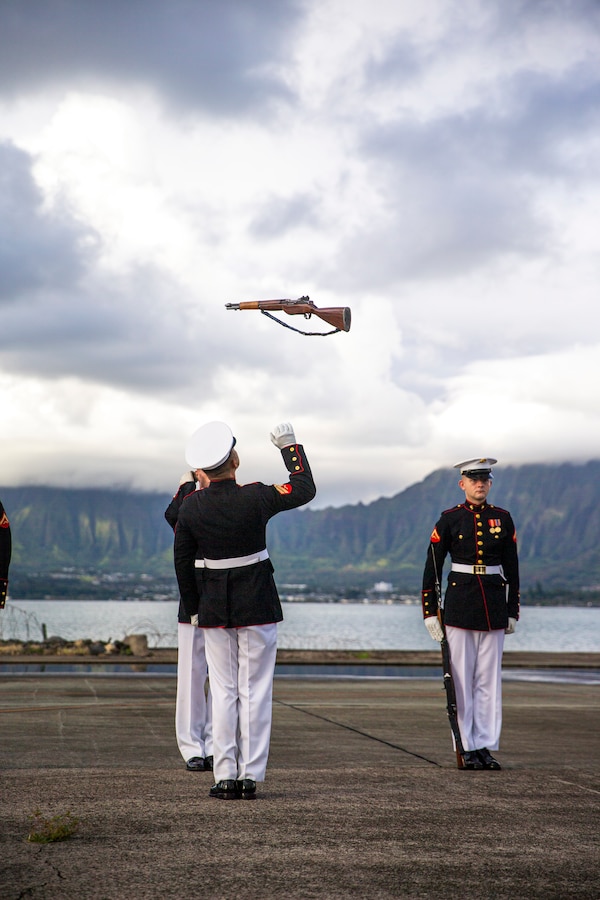 Marines with the Silent Drill Platoon execute their “rifle inspection” sequence on the flight line at Marine Corps Base Hawaii, Sept. 10, 2021. The platoon traveled to MCB Hawaii to perform during the Patriot’s Day Remembrance Ceremony on Sept. 11, 2021. (U.S. Marine Corps photo by Lance Cpl. Tanner D. Lambert)