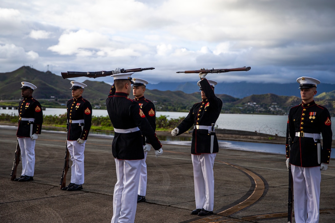 Marines with the Silent Drill Platoon execute their “rifle inspection” sequence on the flight line at Marine Corps Base Hawaii, Sept. 10, 2021. The platoon traveled to MCB Hawaii to perform during the Patriot’s Day Remembrance Ceremony on Sept. 11, 2021. (U.S. Marine Corps photo by Lance Cpl. Tanner D. Lambert)