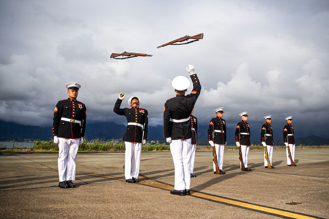 Marines with the Silent Drill Platoon execute their “rifle inspection” sequence on the flight line at Marine Corps Base Hawaii, Sept. 10, 2021. The platoon traveled to MCB Hawaii to perform during the Patriot’s Day Remembrance Ceremony on Sept. 11, 2021. (U.S. Marine Corps photo by Lance Cpl. Tanner D. Lambert)