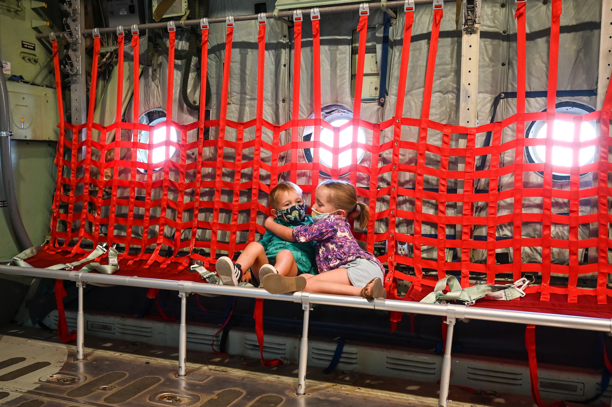 Max and Everly Dunton, Layton hug each other while sitting in the C-130 Experience while visiting Hill Aerospace Museum Sept. 16, 2021, at Hill Air Force Base, Utah. The museum is offering special programs and exhibits during Top of Utah Museum Week, which runs through Sept. 18. (U.S. Air Force photo by Cynthia Griggs)