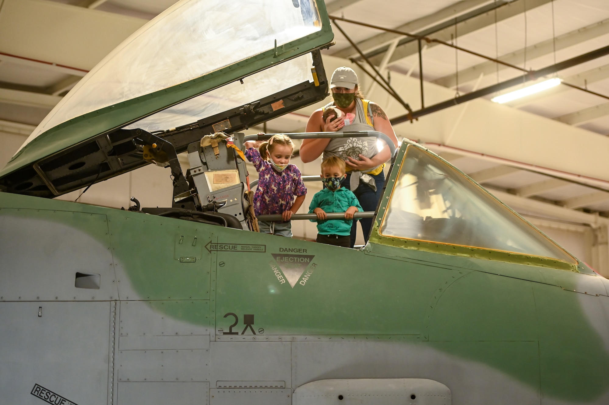 The Dunton family from Layton peer into the cockpit of an A-10 Thunderbolt II while visiting Hill Aerospace Museum Sept. 16, 2021, at Hill Air Force Base, Utah. The museum is offering special programs and exhibits during Top of Utah Museum Week, which runs through Sept. 18. (U.S. Air Force photo by Cynthia Griggs)