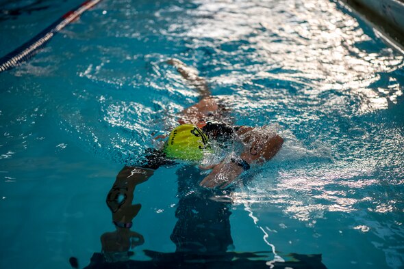A sprint triathlon competitor participates in the 750-yard swim at Dodge Fitness Center on Wright-Patterson Air Force Base, Ohio, Sept. 11. Participants completed a 750-yard swim, 20K bike ride and a 5K run. (U.S. Air Force photo by Staff Sgt. Mikaley Kline)
