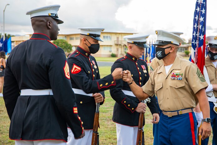 U.S. Marine Corps Sgt. Maj. Jose Romero, sergeant major, Headquarters Battalion, Marine Corps Base Hawaii, greets a fellow Marine during the 9/11 Remembrance Ceremony aboard MCBH, Sept. 11, 2021. Patrons from MCBH got together to recognize the 20th anniversary of the Sept. 11th attacks. (U.S. Marine Corps photo by Cpl. Israel Ballaro)