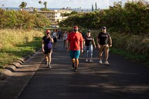 U.S. military service members and civilians participate in the 9/11 Remembrance Walk aboard Marine Corps Base Hawaii, Sept. 11, 2021. Patrons from MCBH got together to recognize the20th anniversary of the Sept. 11th attacks. (U.S. Marine Corps photo by Lance Cpl. Terry Stennett)