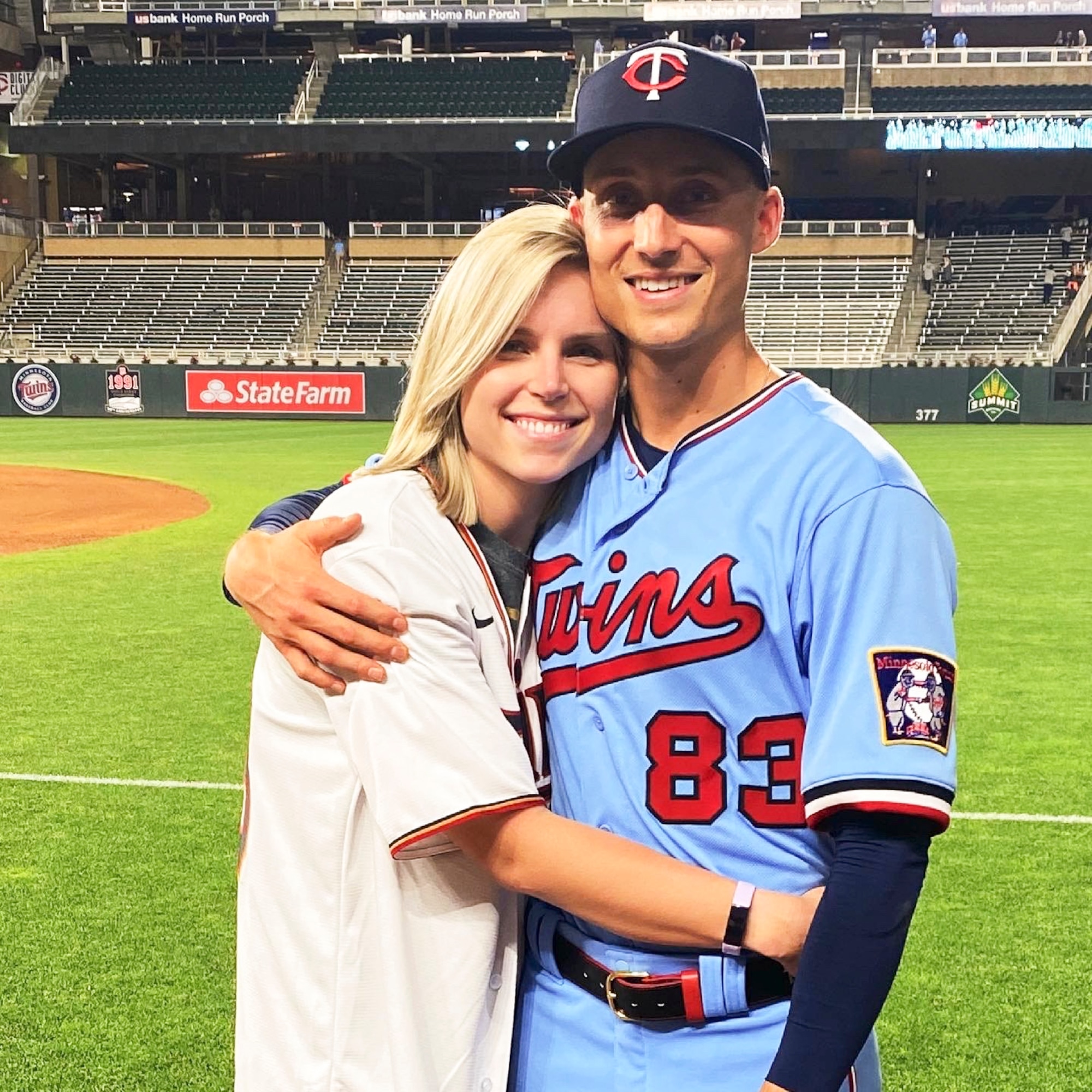 Capt. Griffin Jax, Minnesota Twins pitcher, hugs his wife, Savannah, at his Major League Baseball debut in Kansas City, Missouri, June 5, 2021.
