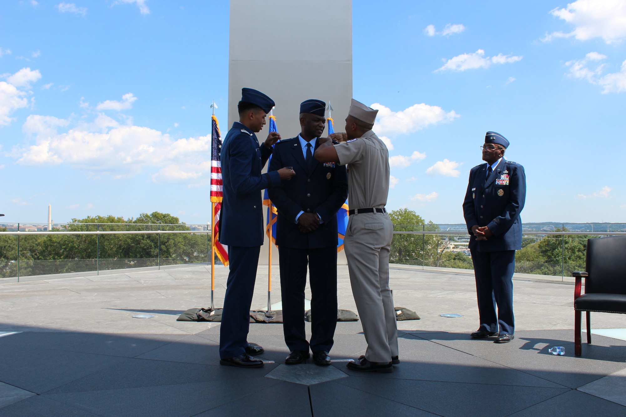 Brig. Gen. Alfred K. Flowers, Jr. (center), Air Force Medical Service Manpower, Personnel and Resources director, gets his brigadier general rank pinned on by his sons, Kendell Flowers (left), a cadet at the U.S. Air Force Academy, and Ayden Flowers, a cadet at Texas A&M, during his promotion ceremony at the Air Force Memorial in Arlington Va., Sept. 7, 2021.