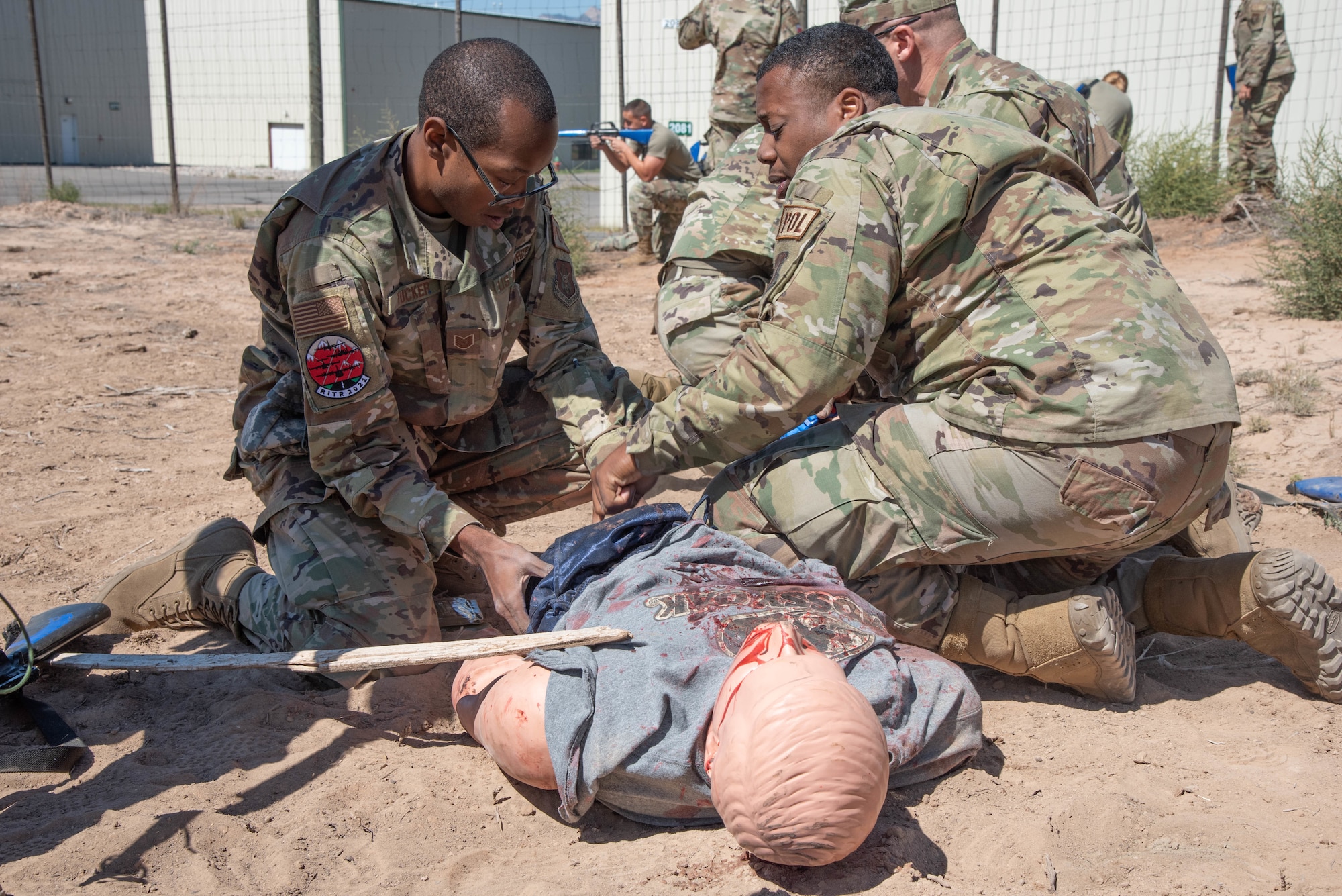 Tech. Sgt. Melvin Tucker, 403rd Logistics Readiness Squadron, Keesler Air Force Base, Mississippi, and Senior Airman Raymond Thomas, 910th LRS, Youngstown Air Reserve Base, Ohio, get hands on Tactical Combat Casualty Care training Sept. 15, 2021, at Rifle Garfield County Airport, Colorado during 22nd Air Force’s flagship exercise Rally in the Rockies Sept. 12-17, 2021. The exericses is aimed at developing Airmen for combat operations. More than 100 Airmen were at Rifle Garfield County Airport, Rifle, Colorado taking part in the air operations portion of the exercise and honing expeditionary skill sets by taking part in Multi-Capable Airmen training where they learned skills from various Air Force jobs to include Wet-Wing Defueling and Tactical Combat Casualty Care. TCCC focuses on care under fire, tactical field care and tactical evacuation care.