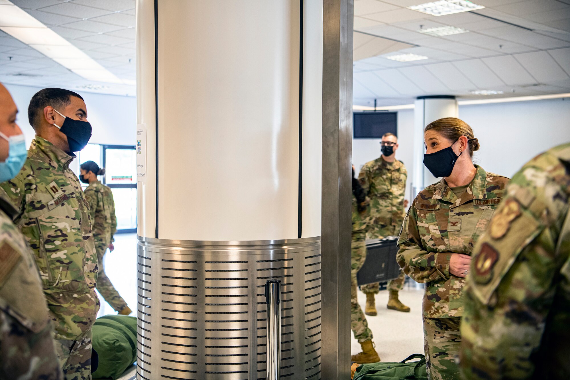 U.S. Air Force Col. Lisa Wildman, right, 501st Combat Support Wing vice commander, speaks with Capt. George Marte, 422d Security Forces Squadron operations officer, at RAF Mildenhall, England, Sept. 16, 2021. Marte along with other defenders from the 501st CSW, 48th Fighter Wing and 100th Air Refueling Wing returned from Ramstein Air Force Base, Germany, after providing support for Operation Allies Refuge. (U.S. Air Force photo by Senior Airman Eugene Oliver)