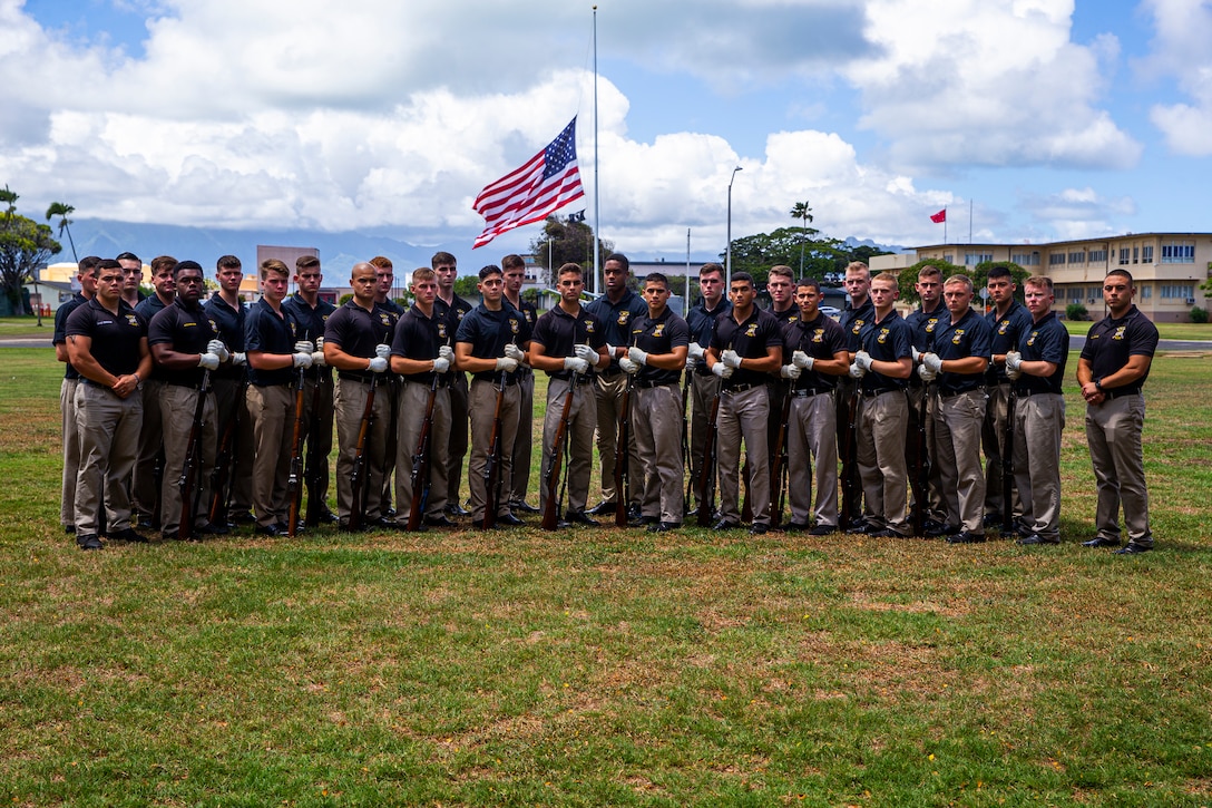 Marines with the Silent Drill Platoon pose for a photo prior to the Patriot’s Day Remembrance Ceremony at Marine Corps Base Hawaii, Sept. 11, 2021.