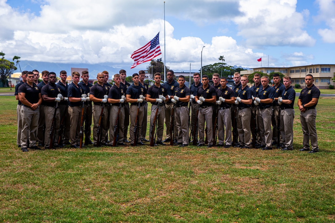 Marines with the Silent Drill Platoon pose for a photo prior to the Patriot’s Day Remembrance Ceremony at Marine Corps Base Hawaii, Sept. 11, 2021. The Patriot’s Day Ceremony is an all-day event that encourages reflection and recognition of the lives lost on September 11, 2001. (U.S. Marine Corps photo by Lance Cpl. Tanner D. Lambert)
