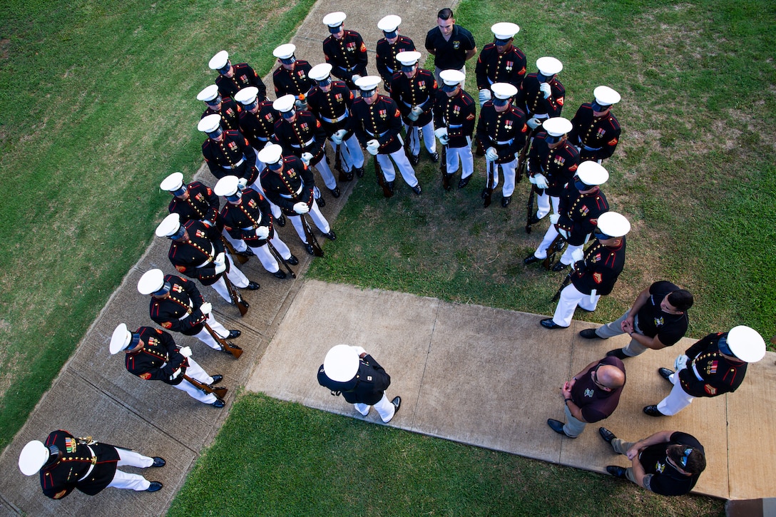 Marines with the Silent Drill Platoon receive a brief from the platoon commander, Capt. Isaac Seals V, prior to the Patriot’s Day Remembrance Ceremony at Marine Corps Base Hawaii, Sept. 11, 2021. The Patriot’s Day Ceremony is an all-day event that encourages reflection and recognition of the lives lost on September 11, 2001. (U.S. Marine Corps photo by Lance Cpl. Tanner D. Lambert)