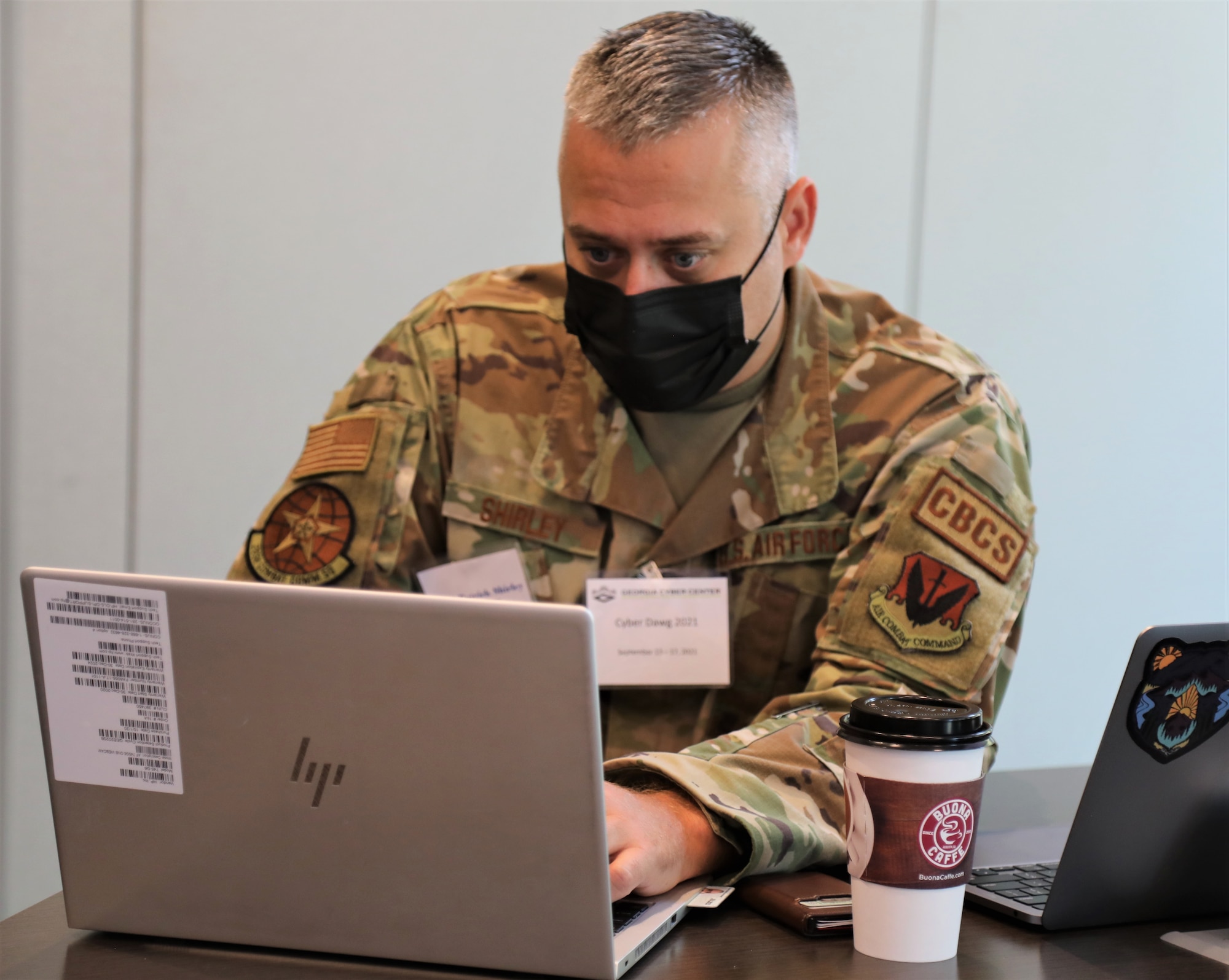 U.S. Air Force Master Sgt. Patrick Shirley, a cybersecurity noncommissioned officer with the 283rd Combat Communications Squadron, 116th Air Control Wing, Georgia Air National Guard, monitors cyber activity during exercise Cyber Dawg 21 Sept. 14, 2021, at the Georgia Cyber Center in Augusta, Georgia. Cyber Dawg 21 participants learned how to expose and correct weaknesses in cyber operations policies and procedures.