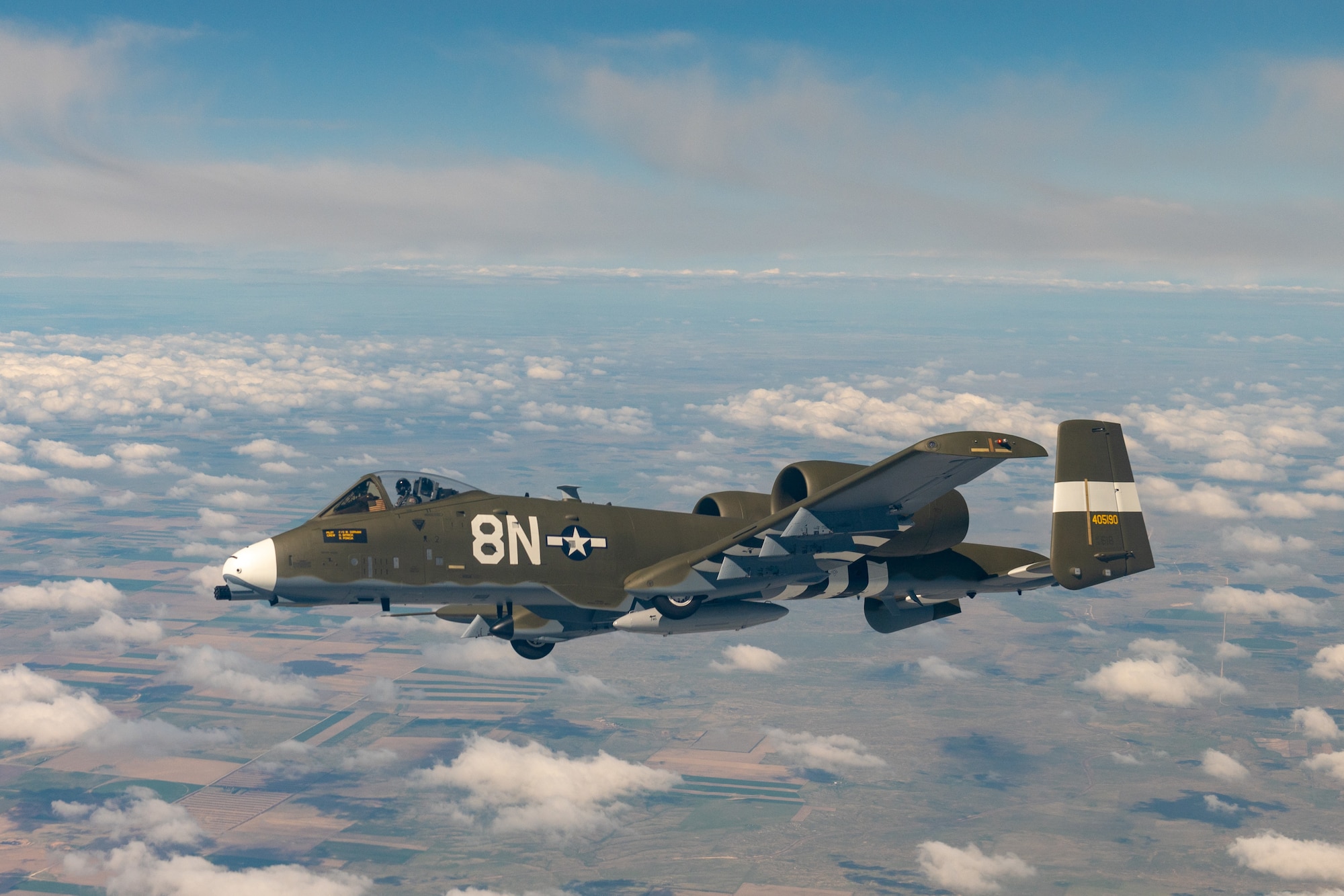 A pilot with the 190th Fighter Squadron, 124th Fighter Wing, Boise, Idaho, flies an A-10 Thunderbolt II with a newly painted World War II heritage paint scheme from the Air National Guard’s paint facility in Sioux City, Iowa to its new home at the Idaho Air National Guard, Gowen Field, Idaho, May 12, 2021. The heritage A-10 aircraft was painted to commemorate the 190FS’s 75th Anniversary and made to mimic the 1944 version of the P-47 Thunderbolt flown in WWII by the 405th Fighter Squadron, which was later re-designated as the 190FS. (U.S. Air National Guard photo by Staff Sgt Mercedee Wilds)