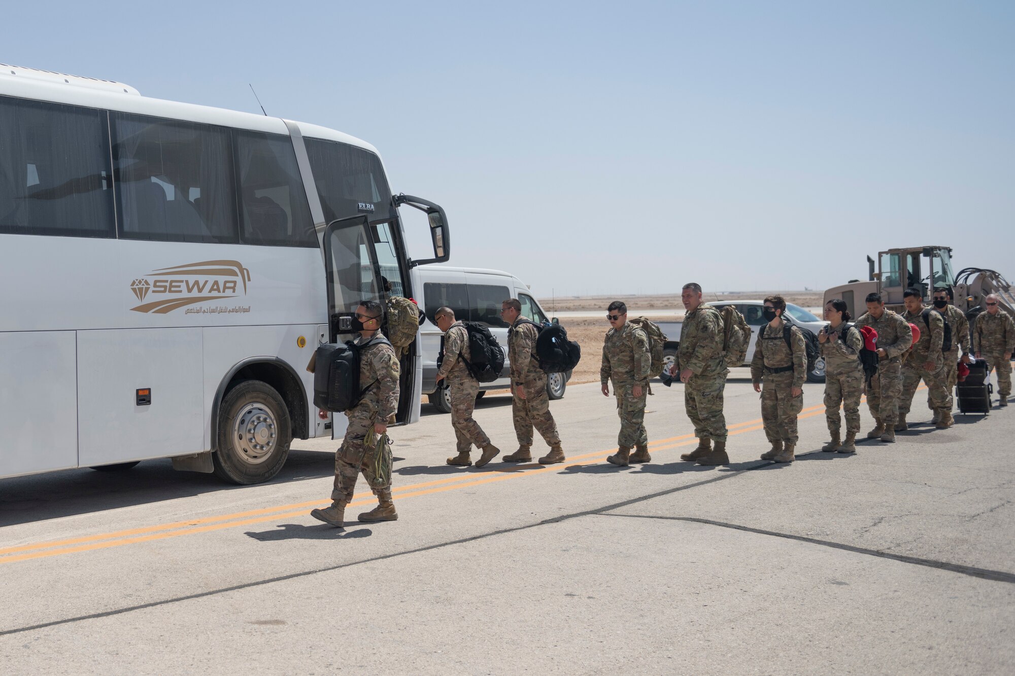 U.S. Airmen with the 332nd Air Expeditionary Wing and the 557th Expeditionary Red Horse Squadron return from Al Udeid Air Base, Qatar, after a forward deployment