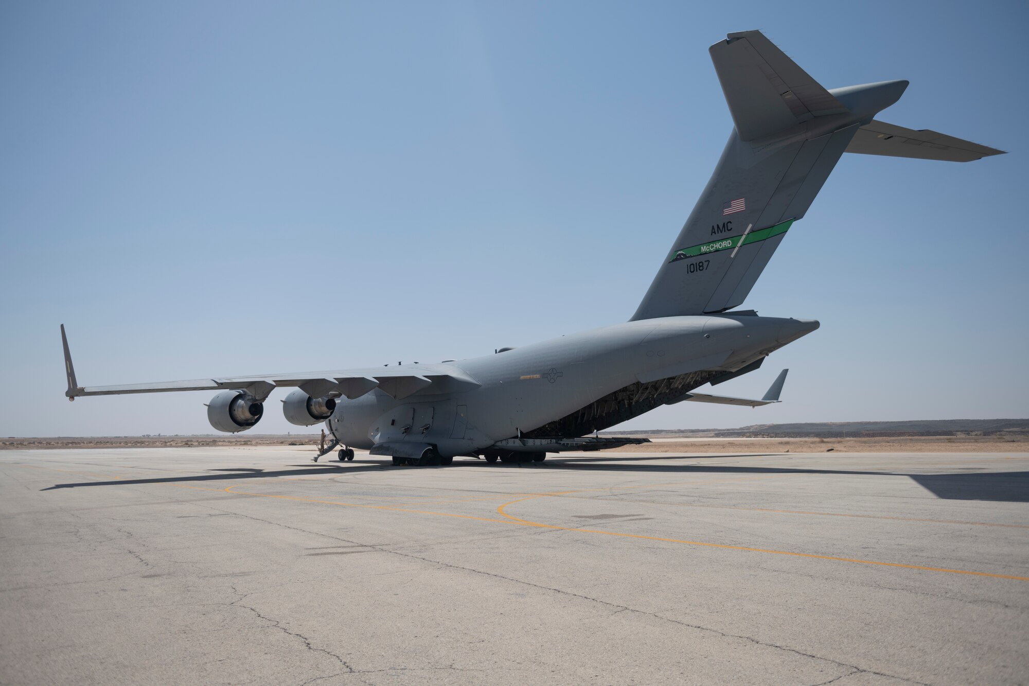 U.S. Airmen with the 332nd Air Expeditionary Wing and the 557th Expeditionary Red Horse Squadron return from Al Udeid Air Base, Qatar, after a forward deployment