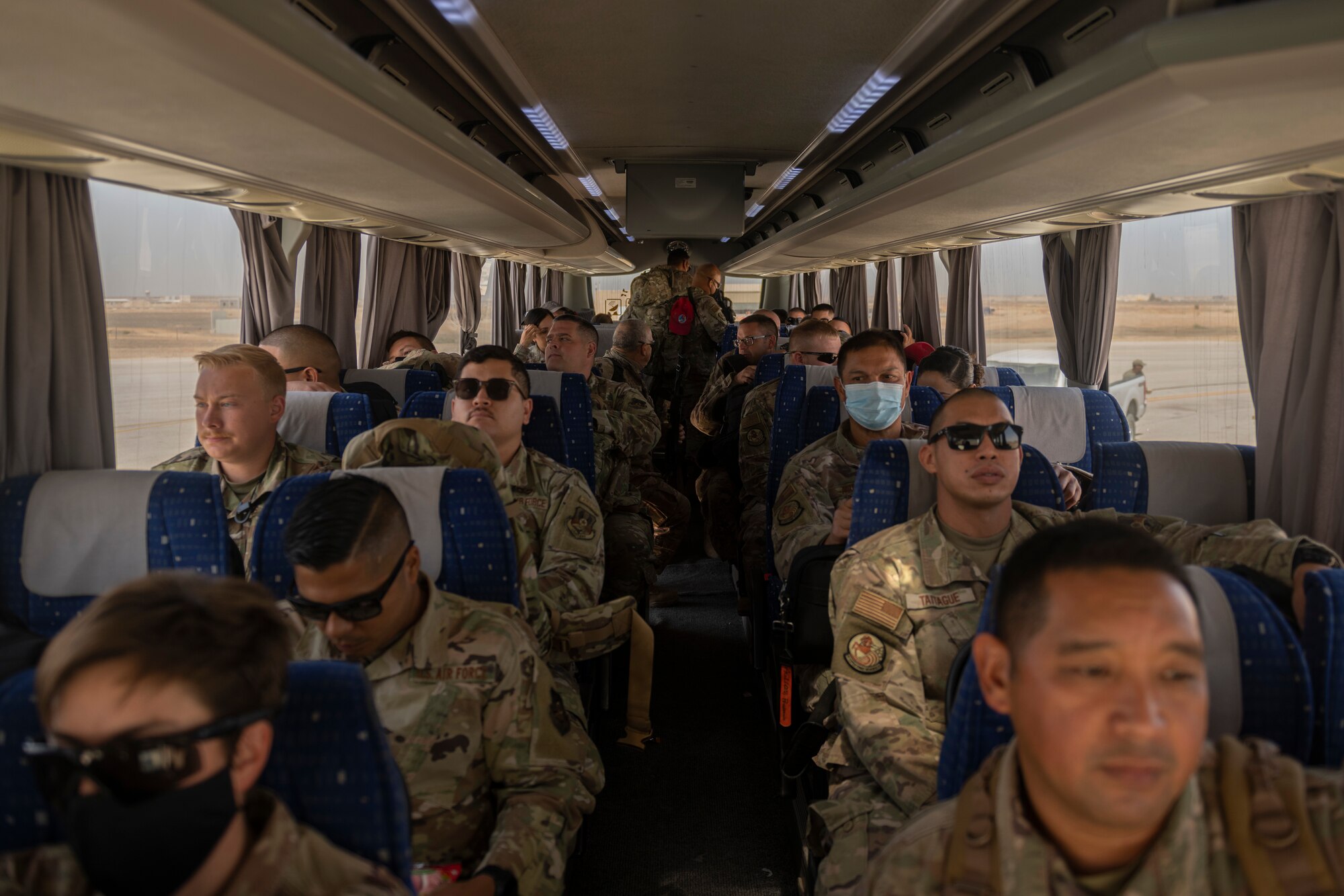 U.S. Airmen with the 332nd Air Expeditionary Wing and the 557th Expeditionary Red Horse Squadron return from Al Udeid Air Base, Qatar, after a forward deployment