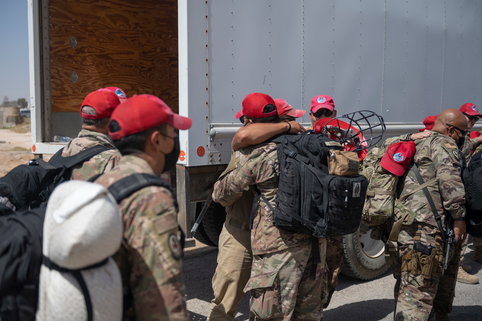 U.S. Airmen with the 332nd Air Expeditionary Wing and the 557th Expeditionary Red Horse Squadron return from Al Udeid Air Base, Qatar, after a forward deployment