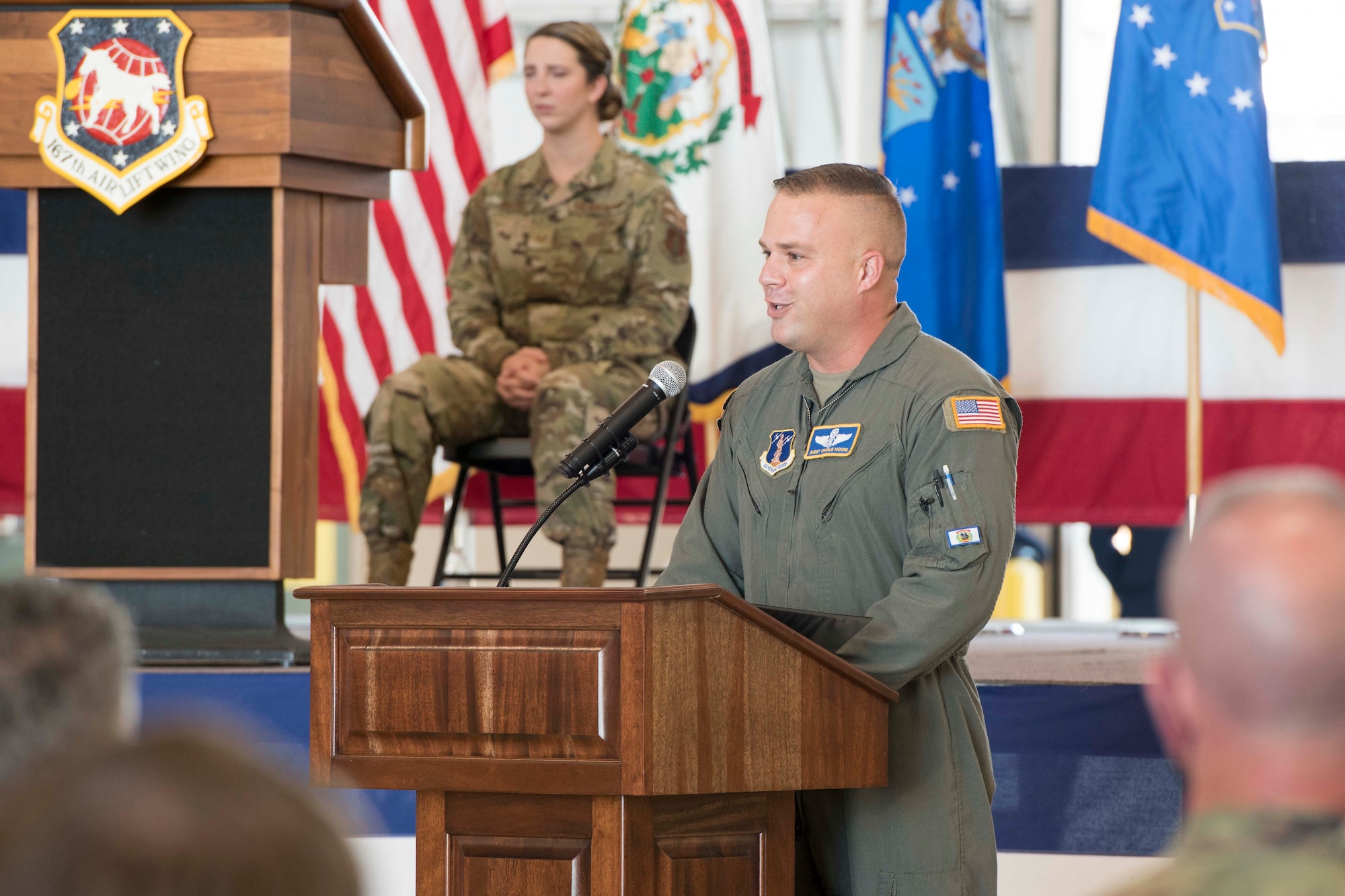 U.S. Air Force Senior Master Sgt. Charlie Moore, 167th Operations Group loadmaster, delivers a eulogy for Lt. Col. Barry Rowekamp, during a memorial service held at the 167th Airlift Wing, Martinsburg, West Virginia, Aug. 19, 2021. Rowekamp, the wing’s chief of aerospace medicine, passed on Aug. 6. (U.S. Air National Guard photo by Senior Master Sgt. Emily Beightol-Deyerle)