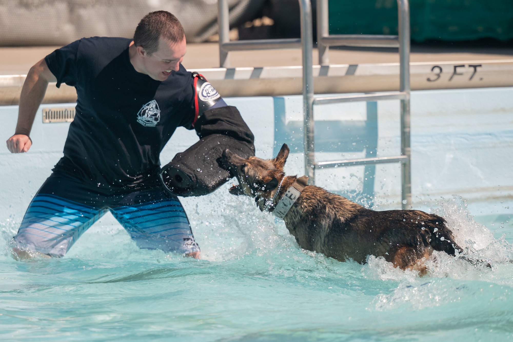 Photo of Airmen and K-9