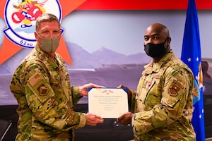 U.S. Air Force Col. William Ray, 56th Maintenance Group commander, awards the Bronze Star Medal to U.S. Air Force Master Sgt. Thomas Williams, 62nd Aircraft Maintenance Unit weapons loading non-commissioned officer in charge, for meritorious achievement in a deployed location Sept. 1, 2021, at Luke Air Force Base, Arizona.