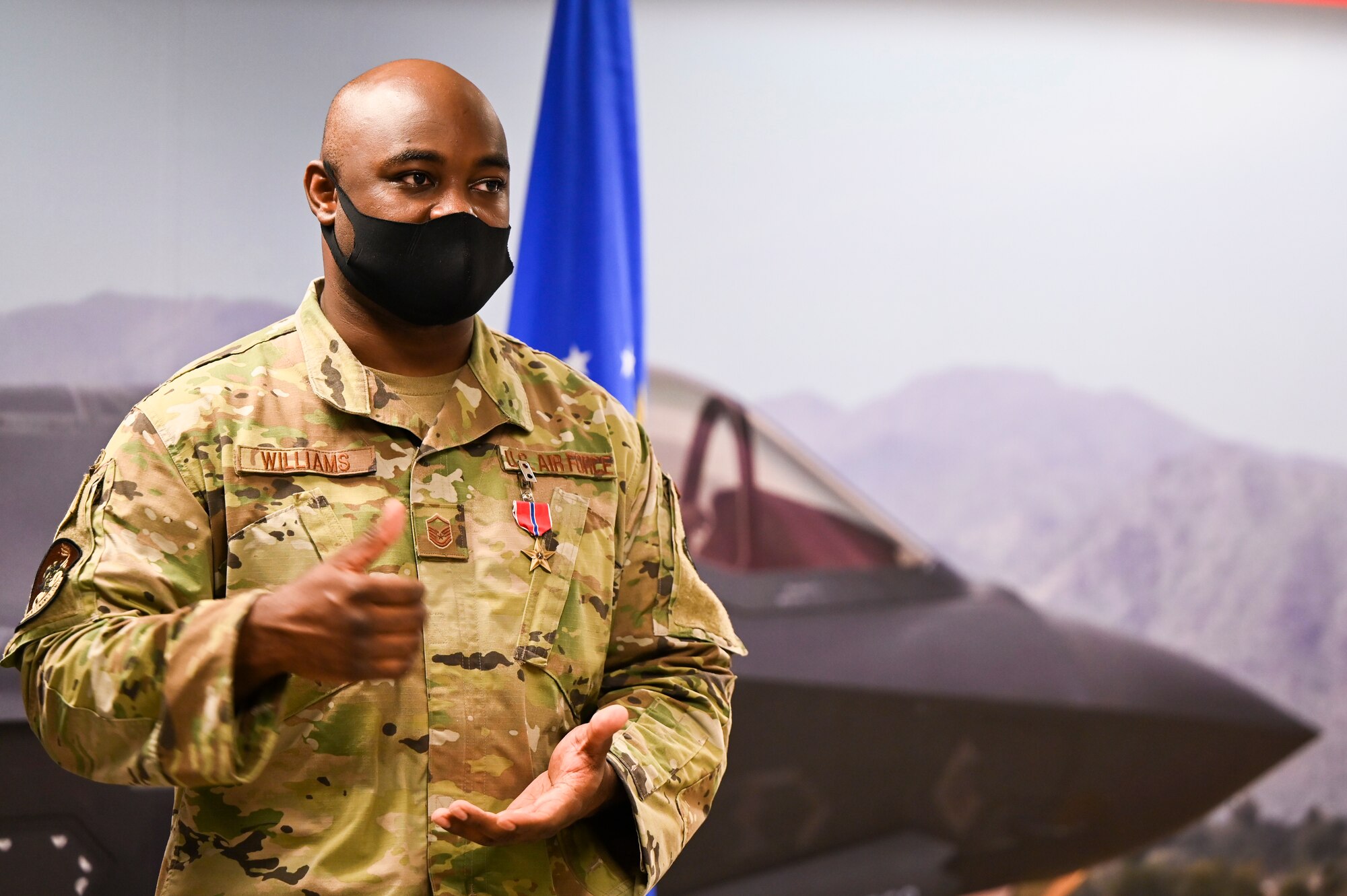 U.S. Air Force Master Sgt. Thomas Williams, 62nd Aircraft Maintenance Unit weapons loading non-commissioned officer in charge, receives the Bronze Star Medal for meritorious achievement in a deployed location Sept. 1, 2021, at Luke Air Force Base, Arizona.