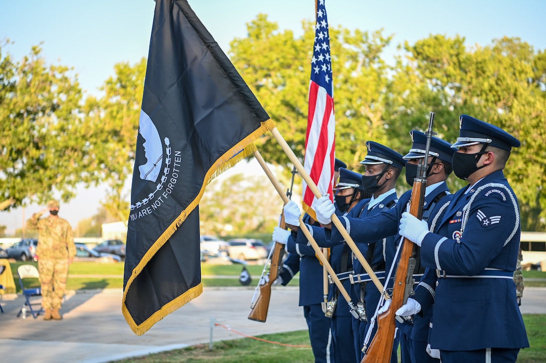 Members of the base honor guard post the colors for the National Anthem during the POW/MIA ceremony Sept. 17, 2021, at Hill Air Force Base, Utah. Former prisoner of war and retired Air Force Capt. William Robinson was the featured speaker. Robinson was a POW for nearly eight years before being released. (U.S. Air Force photo by Cynthia Griggs)