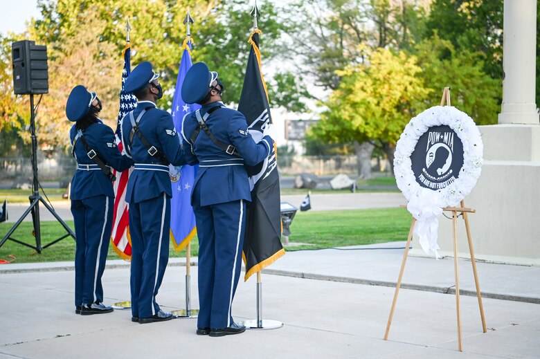 Members of the base honor guard dress the colors during the POW/MIA ceremony Sept. 17, 2021, at Hill Air Force Base, Utah. The ceremony served to remember and honor those Americans who were prisoners of war and those who served and never returned home. (U.S. Air Force photo by Cynthia Griggs)