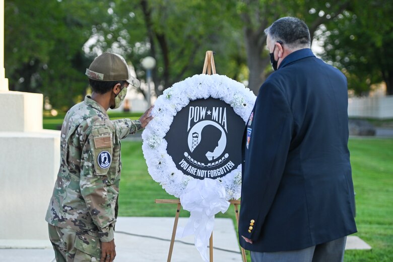 Col. Jenise Carroll, 75th Air Base Wing commander, and former prisoner of war and retired Air Force Capt. William Robinson present the POW/MIA wreath during the POW/MIA ceremony Sept. 17, 2021, at Hill Air Force Base, Utah. Robinson, who was a POW for nearly eight years before being released, was the featured speaker. (U.S. Air Force photo by Cynthia Griggs)