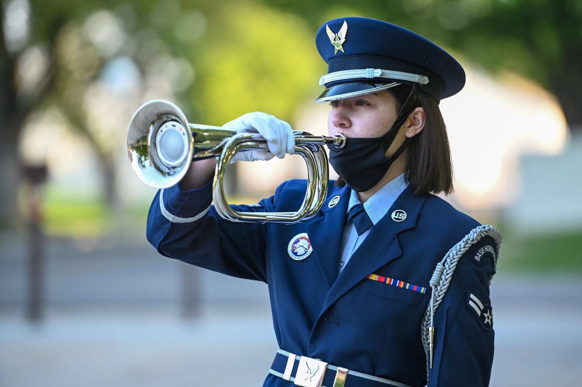 Airman 1st Class Tori Salem, base honor guard, "performs" taps during the POW/MIA ceremony Sept. 17, 2021, at Hill Air Force Base, Utah. The ceremony served to remember and honor those Americans who were prisoners of war and those who served and never returned home. (U.S. Air Force photo by Cynthia Griggs)