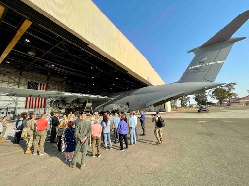 McConnell Air Force Base civic leaders receive a maintenance brief on the C-5 Galaxy during a Civic Leader Tour Sep. 14, 2021 at Travis AFB, Cali. McConnell civic leaders traveled to Travis AFB to expand their knowledge on the rapid global mobility mission that Air Mobility Command provides the U.S. Air Force. (U.S. Air Force photo by Leigh Bellinger)