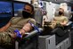 From left, U.S. Air Force Airman 1st Class Tyrese Baylis, 33rd Maintenance Squadron, low observables aircraft structural maintenance journeyman, and Master Sgt. Travis Bulay, 33rd Maintenance Squadron aircrew ground equipment flight chief, donates blood on the Big Red Bus Sept. 17, 2021 at Eglin Air Force Base, Florida. Baylis and Bulay donated blood as part of a blood drive held by the 33rd Maintenance Squadron. (U.S. Air Force photo by Senior Airman Heather LeVeille)