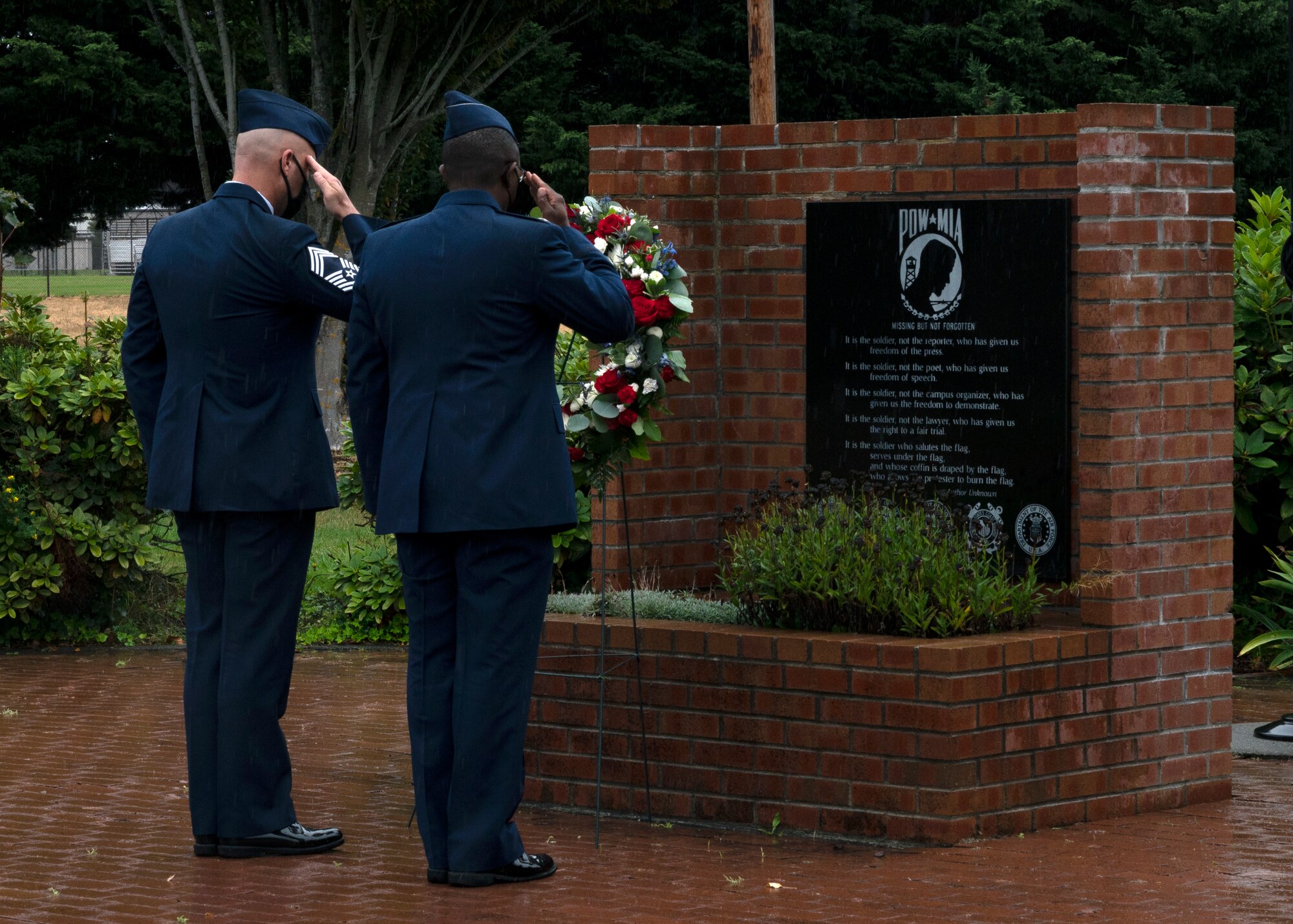(From left) U.S. Air Force Chief Master Sgt. Christopher Clark, 627th Air Base Group superintendent, and Col. Christopher Hall, 627th ABG commander, render a salute after placing a wreath at the POW/MIA memorial at Joint Base Lewis-McChord, Washington, Sept. 17, 2021. Team McChord Airmen gathered at the McChord War Memorial for the wreath ceremony to pay their respects to the more than 81,000 American heroes who were, and may still be, missing in action and those who were prisoners of war. (U.S. Air Force photo by Senior Airman Zoe Thacker)