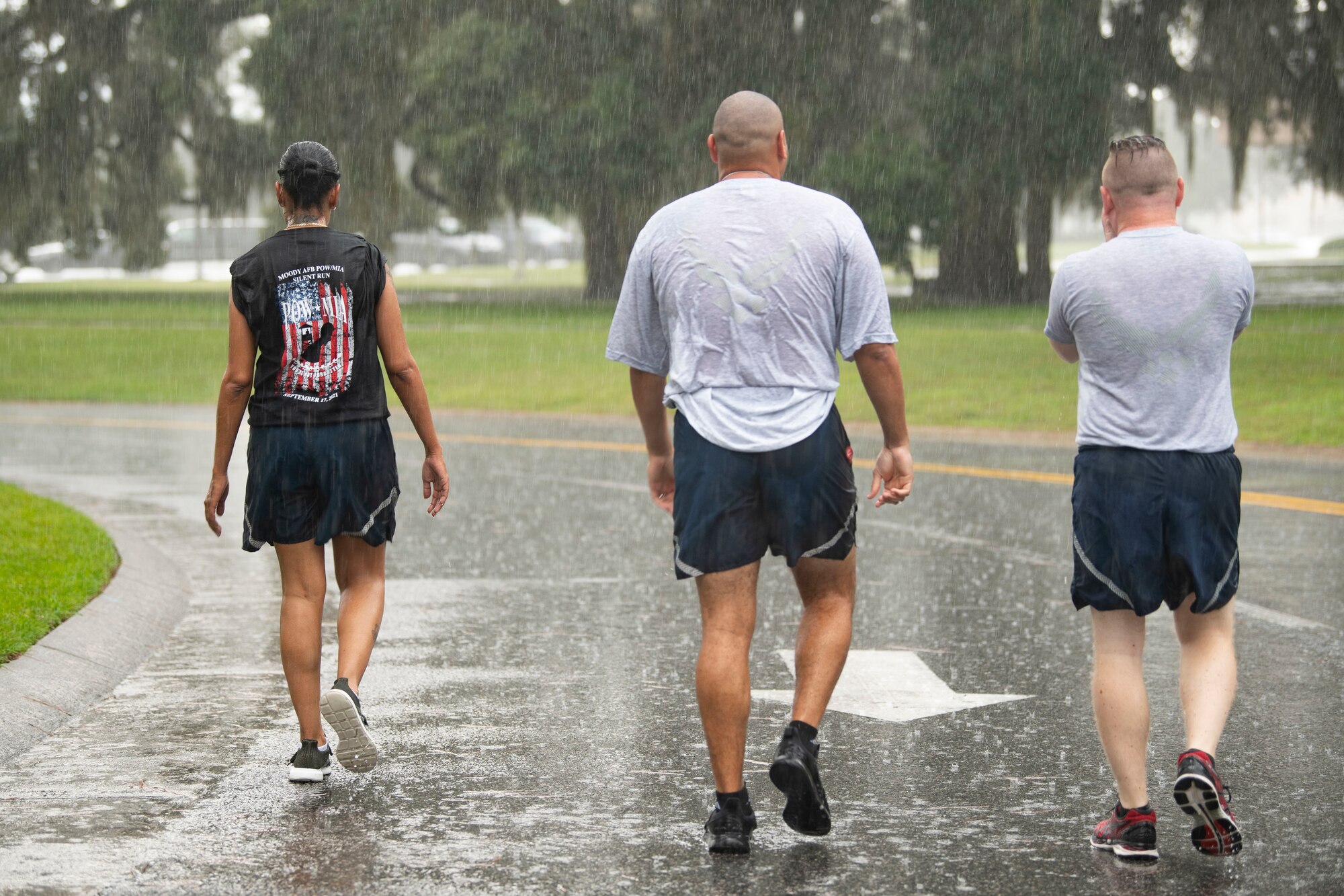 People run in rain.