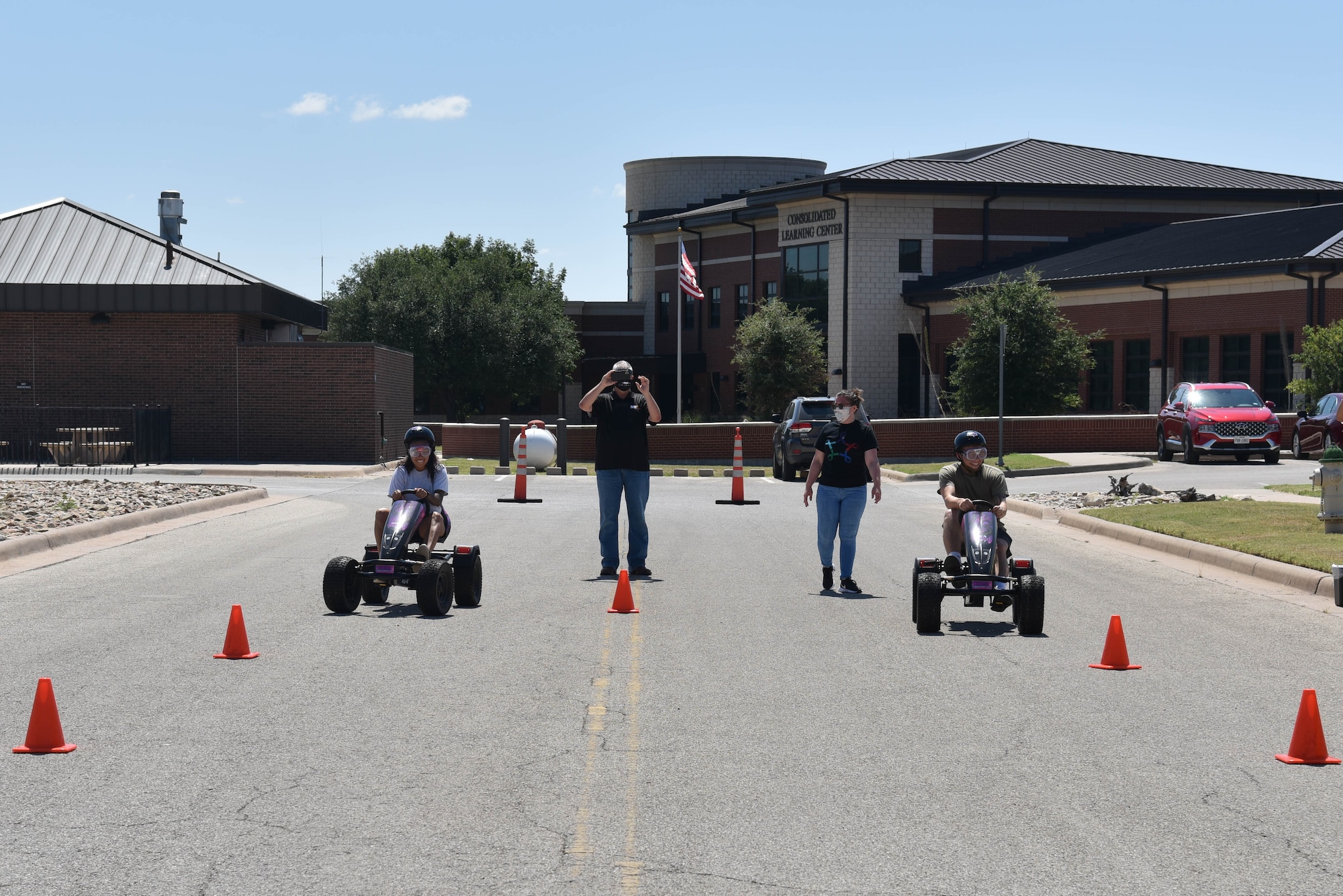 U.S. Air Force 17th Security Forces Squadron Airmen race each other to finish a challenge during the Raider Race scavenger hunt during Wing Sports Day on Goodfellow Air Force Base, Sept. 17, 2021. Members wore simulation goggles while driving go-carts to test their hand and eye coordination for this challenge. (U.S. Air Force photo by Senior Airman Jermaine Ayers)