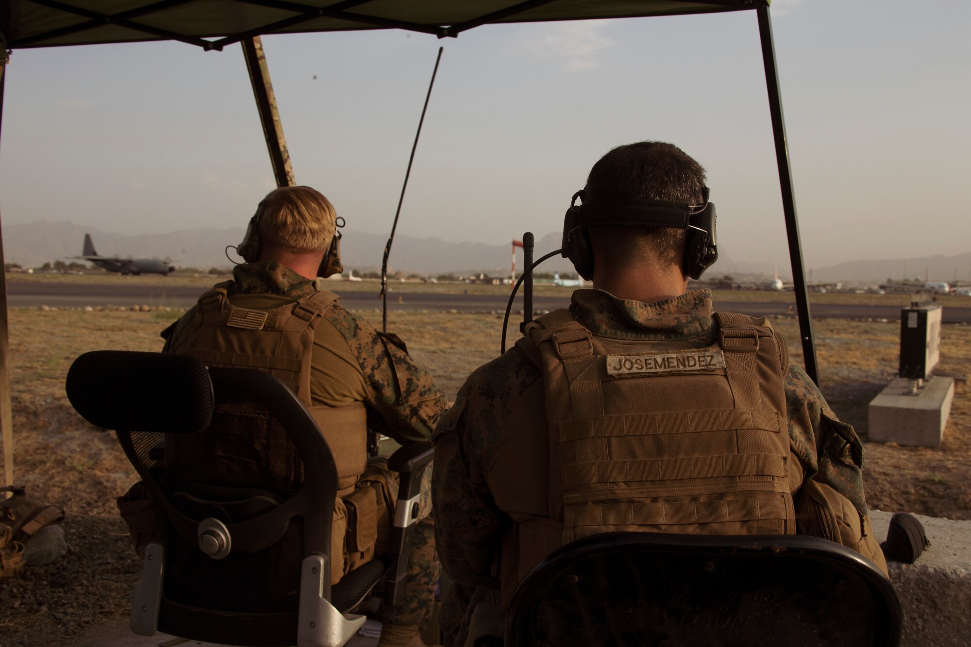 Marines assigned to the 24th Marine Expeditionary Unit monitor the air traffic control center at Hamid Karzai International Airport, Afghanistan, Aug. 22. U.S. service members are assisting the Department of State with a Non-combatant Evacuation Operation (NEO) in Afghanistan. (U.S. Marine Corps photo by Cpl. Davis Harris)