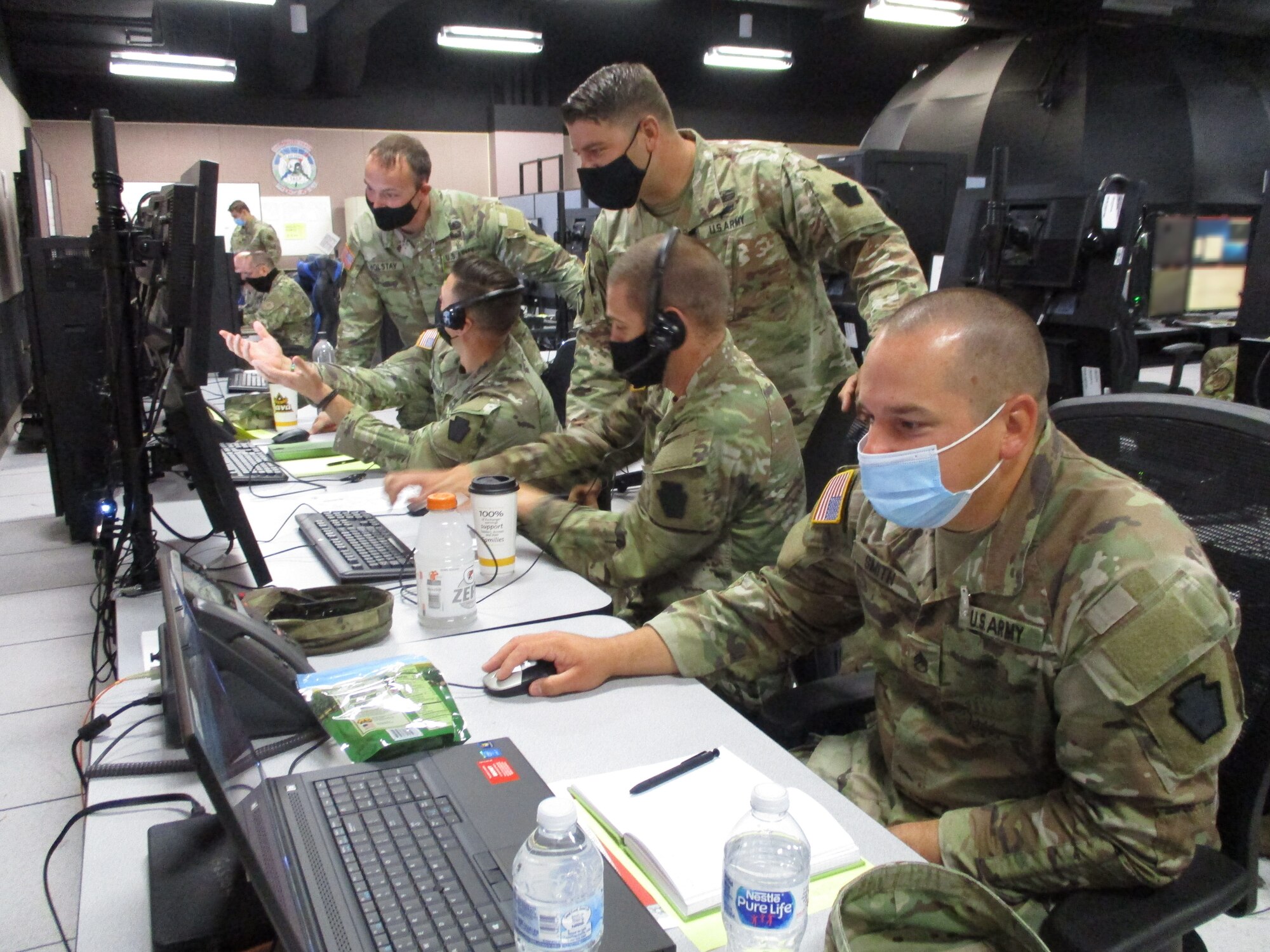 U.S. service members working at computers