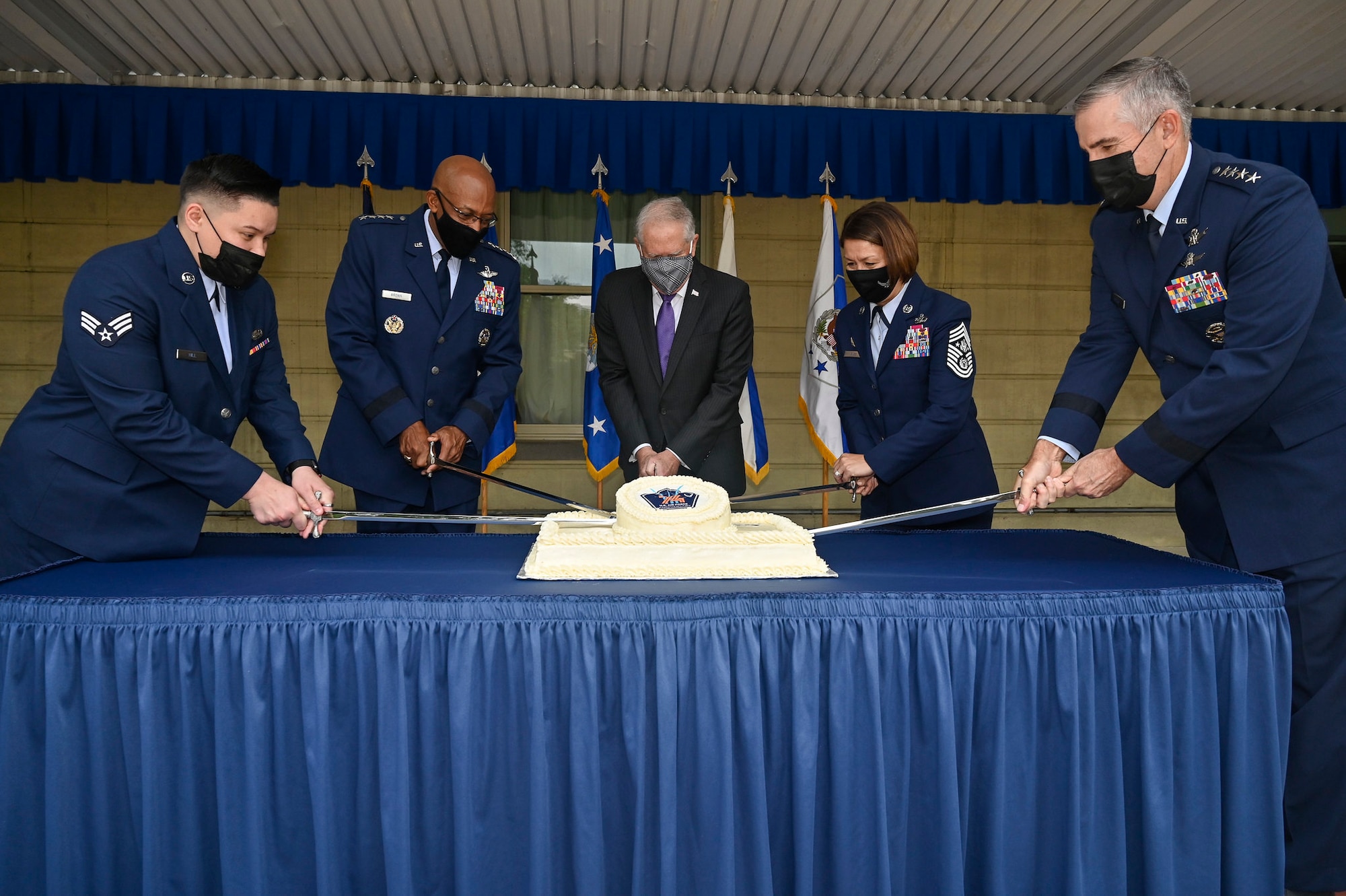 Senior Airman Alexis Hill, left, the youngest Airman present, Air Force Chief of Staff Gen. CQ Brown Jr., Secretary of the Air Force Frank Kendall, Chief Master Sgt. of the Air Force JoAnne S. Bass and Gen. John E. Hyten, vice chairman of the Joint Chiefs of Staff, cut the cake during the Air Force’s 74th birthday celebration at the Pentagon in Arlington, Va., Sept. 17, 2021. (U.S. Air Force photo by Eric Dietrich)