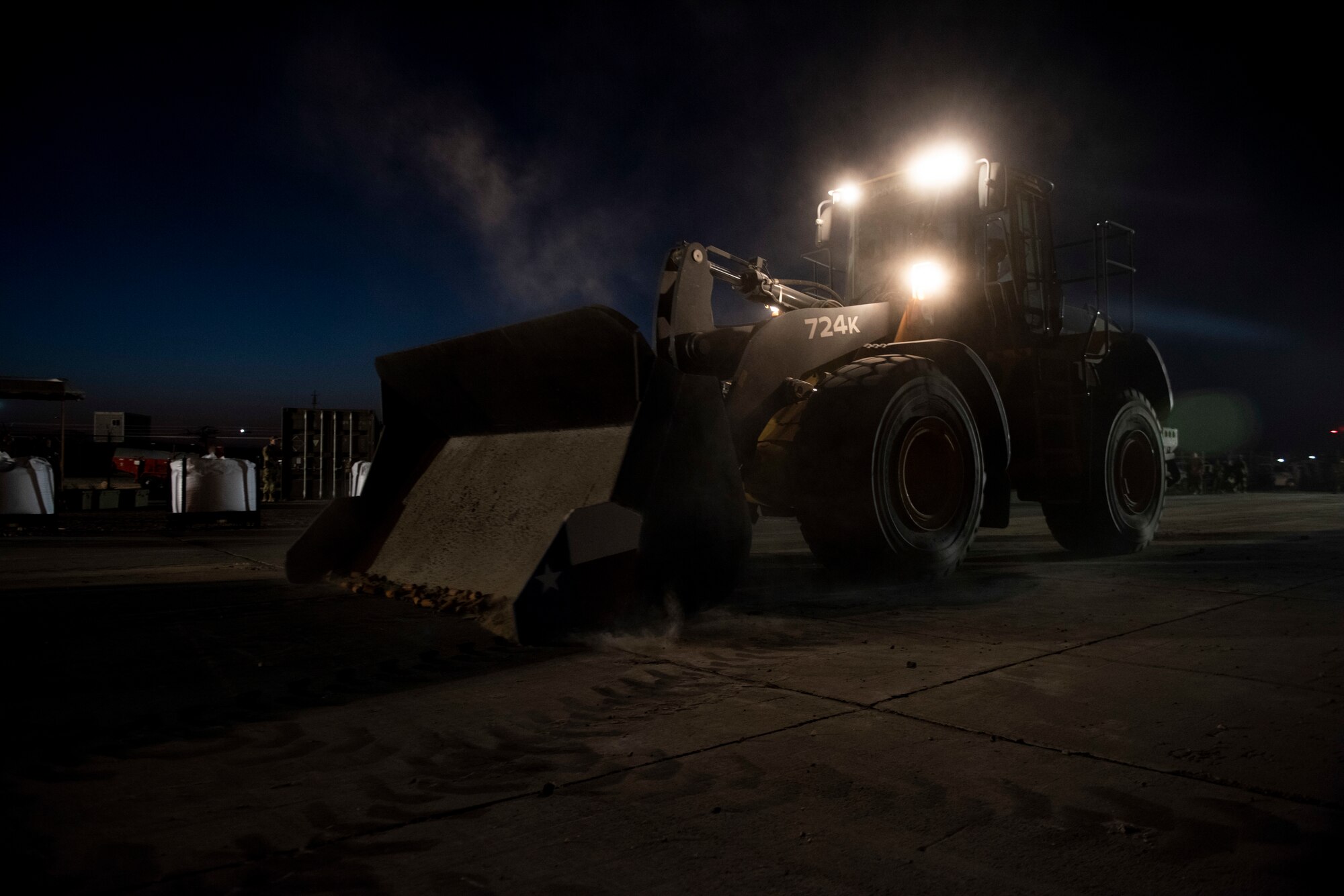 A photo of a bulldozer pushing debris