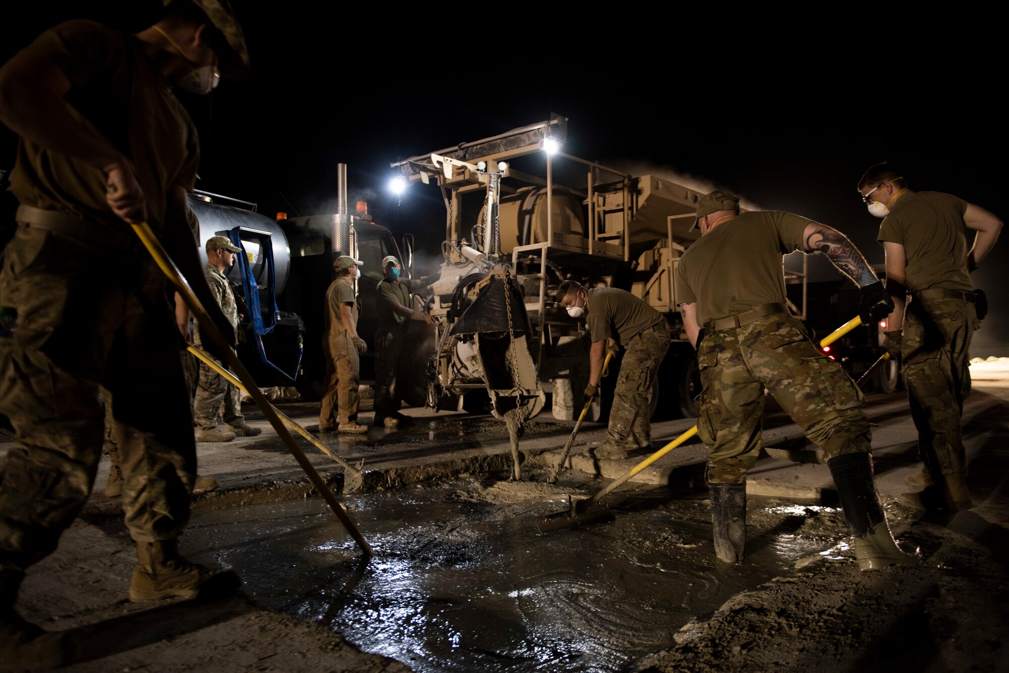 A photo of Airmen spreading cement