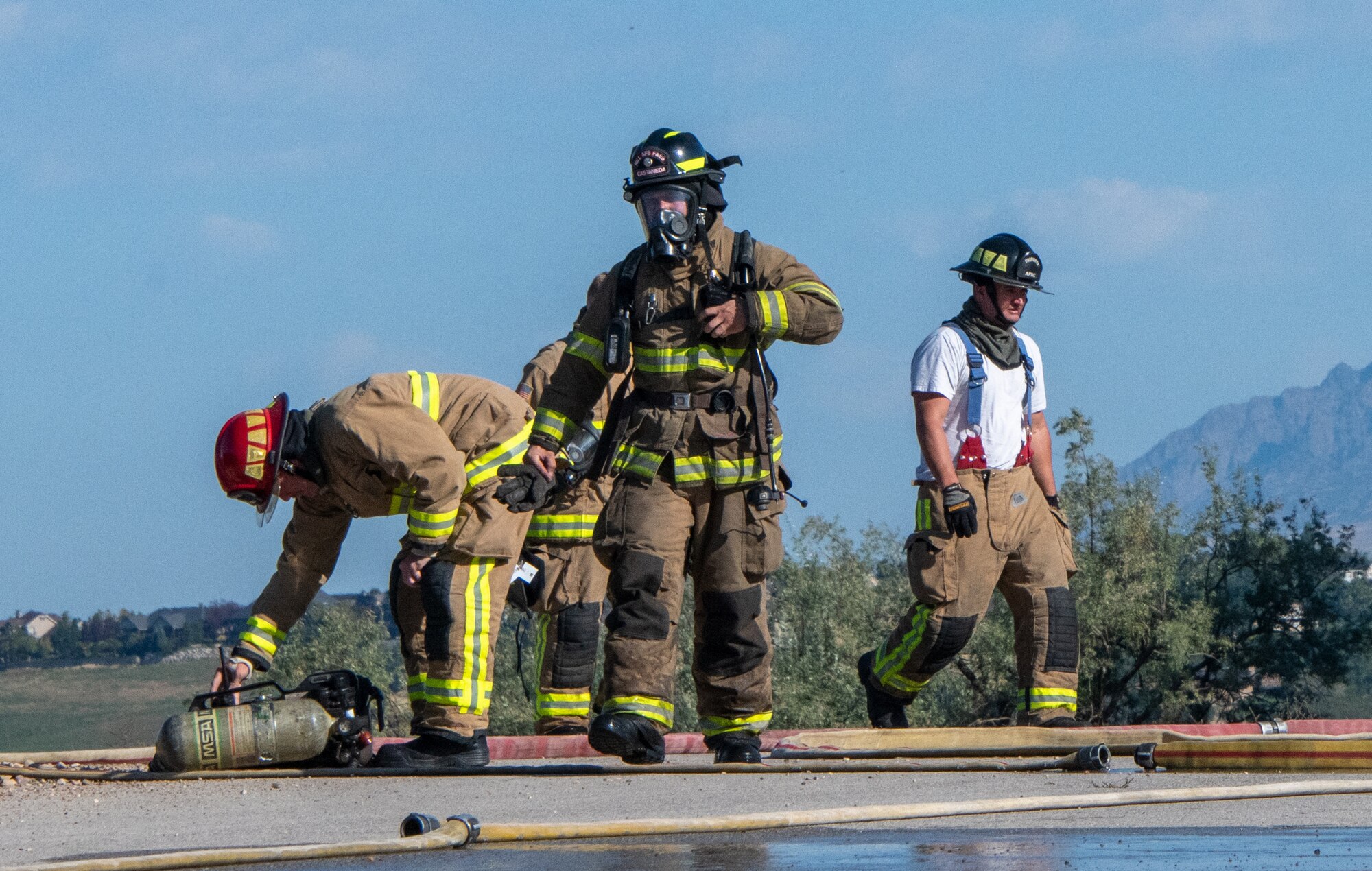 Reserve firefighters from the 419th Civil Engineer Squadron respond to an aircraft live-fire burn at Hill Air Force Base