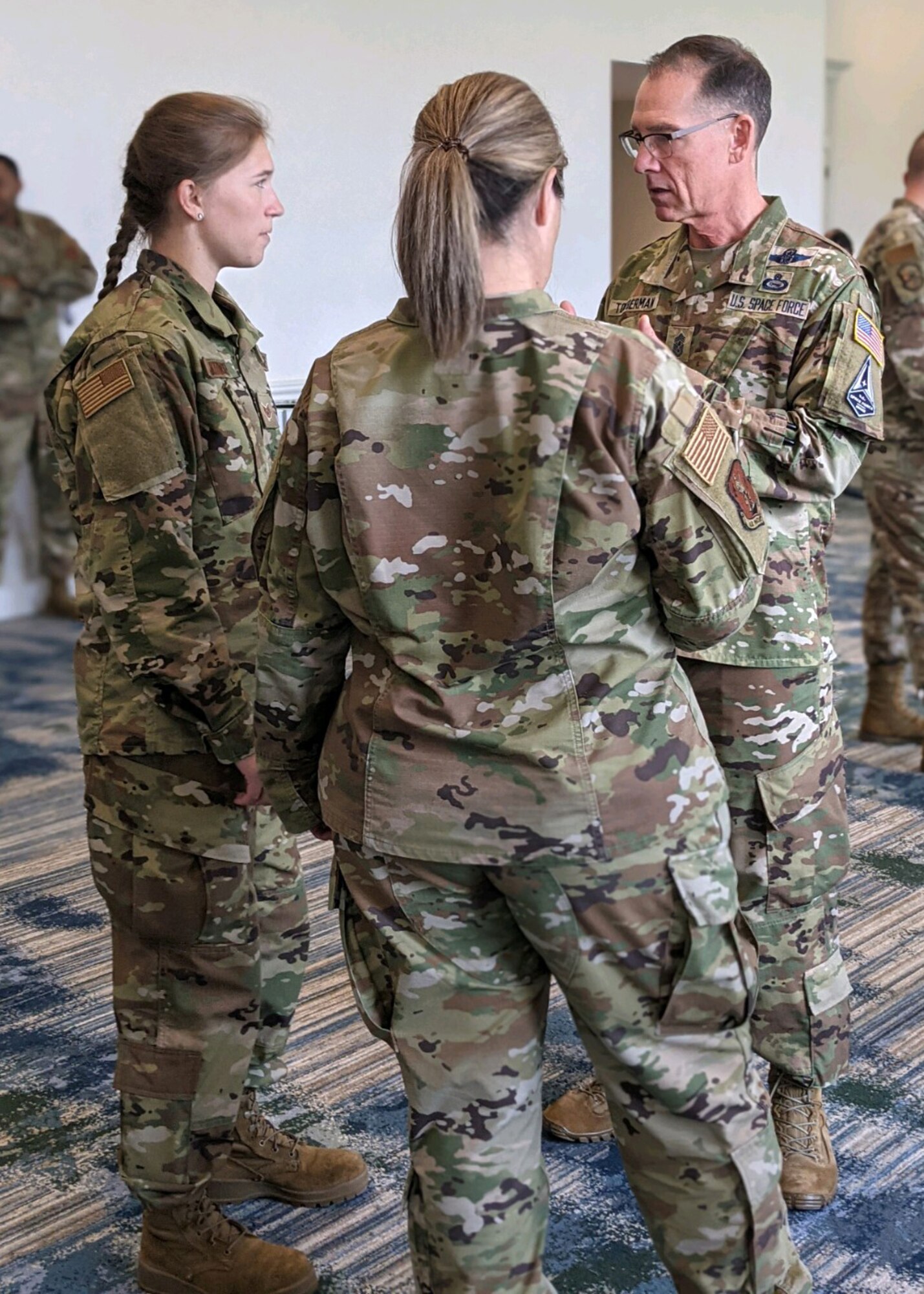 Chief Master Sgt. Laurice Souron and Staff Sgt. Sara Kolinski speak with Command Chief Master Sgt. of the Space Force Roger A. Towberman, 1st CMSSF, at the Air Force Sergeants Association Professional Education and Development Symposium July 28, 2021, in Orlando Florida.  During the symposium the 104th Fighter Wing members met with Air Force senior enlisted leaders and discussed ways that the Air and Space Forces plan to accelerate change.  (U.S. Air National Guard courtesy photo)