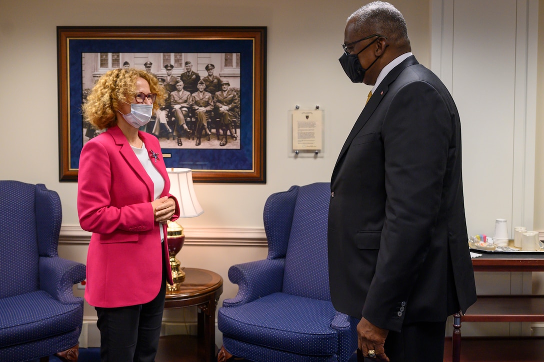 A woman and a man are engaged in conversation.