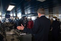 Military Sealift Command Ship Master Joseph Darlak, right, addresses Jessica Long, chargé d’affaires, U.S. embassy in Namibia, second from right, His Worship Trevino Forbes, Mayor of Walvis Bay, third from right, Namibian Navy Rear Adm. Alweendo Paulus Amungulu, fourth from right, and a group of Namibian Navy leadership and U.S. embassy personnel during a tour of the Expeditionary Sea Base USS Hershel "Woody" Williams (ESB 4), Sept. 17, 2021.