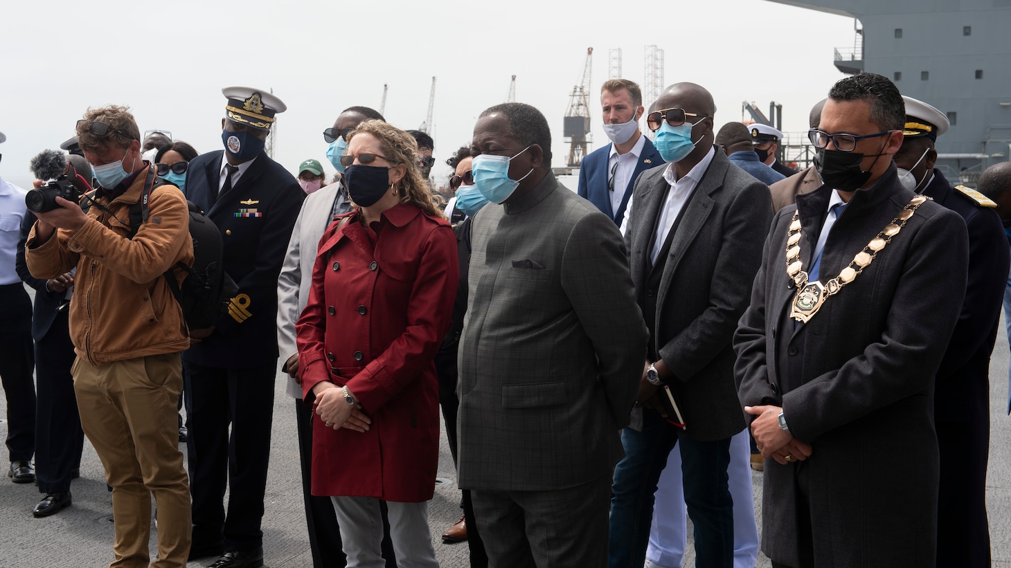 Jessica Long, charges d'affaires, U.S. embassy in Windhoek, Namibia, center left, Hon. Frans Kapofi, Namibian minister of defense, center right, and His Worship Trevino Forbes, Mayor of Walvis Bay, right, listen to the Role Two Light Maneuver medical team explain their capabilities during a tour for Namibian Navy leadership aboard the Expeditionary Sea Base USS Hershel "Woody" Williams (ESB 4), Sept. 17, 2021.