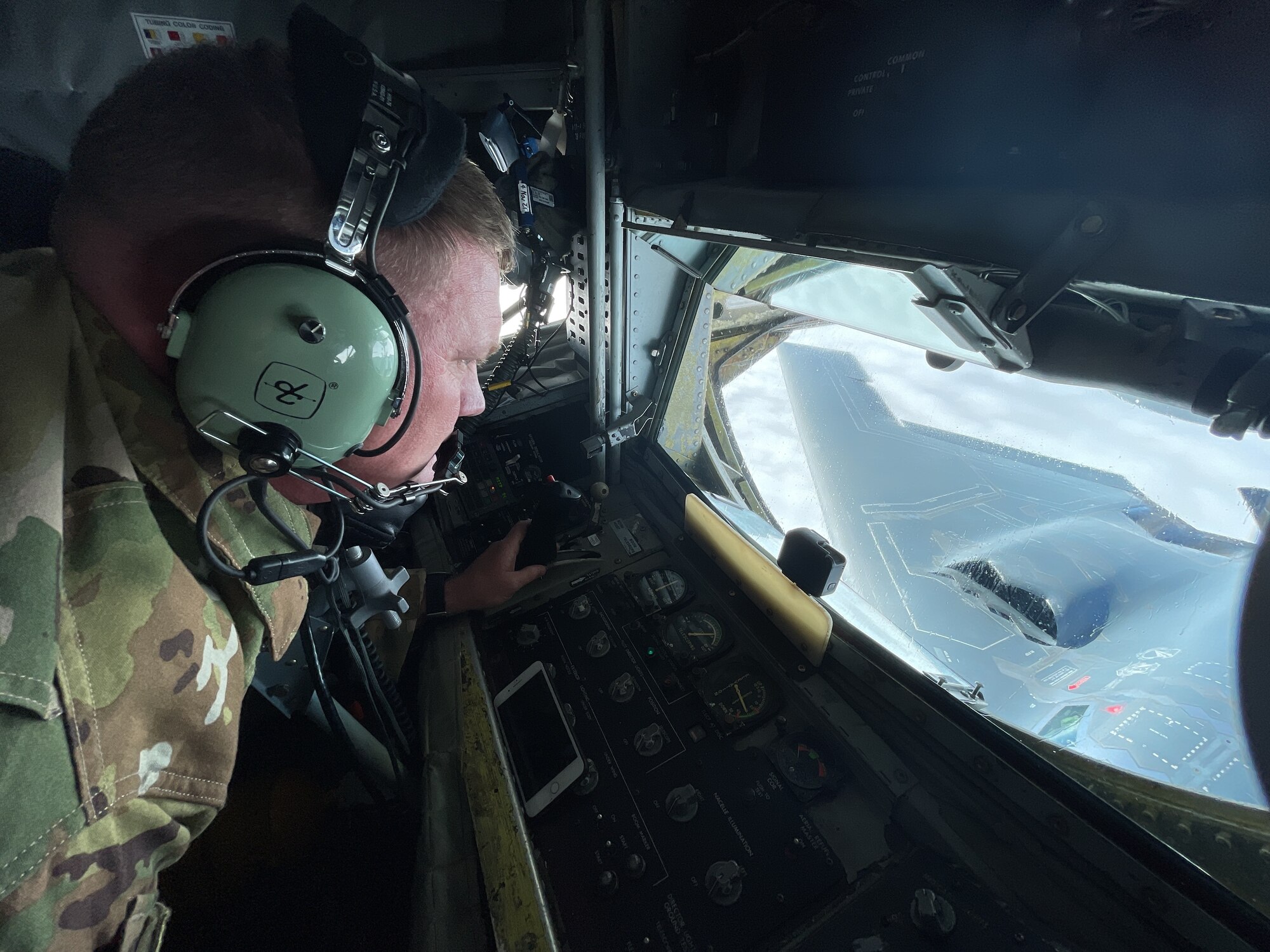 U.S. Air Force Master Sgt. Dustin Clark, Headquarters U.S. Air Forces in Europe standards and evaluations command air refueling evaluator, refuels a B-2 Spirit aircraft assigned to the 509th Bomb Wing, Whiteman Air Force Base, Missouri, over Europe during a bomber task force mission Sept. 8, 2021. U.S. bomber aircraft contribute to European regional security with the support of U.S. Air Forces in Europe and Air Forces Africa’s only permanent air refueling wing. (U.S. Air Force photo by Senior Airman Joseph Barron)