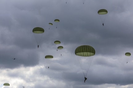 Participants from 12 NATO allied forces and local citizens paid homage to the 77th Anniversary of Operation Market Garden by gathering at a series of drop zones across the Netherlands and Belgium to observe one thousand Soldiers parachuting from U.S Air Force C-130s and allied force aircrafts during Falcon Leap.