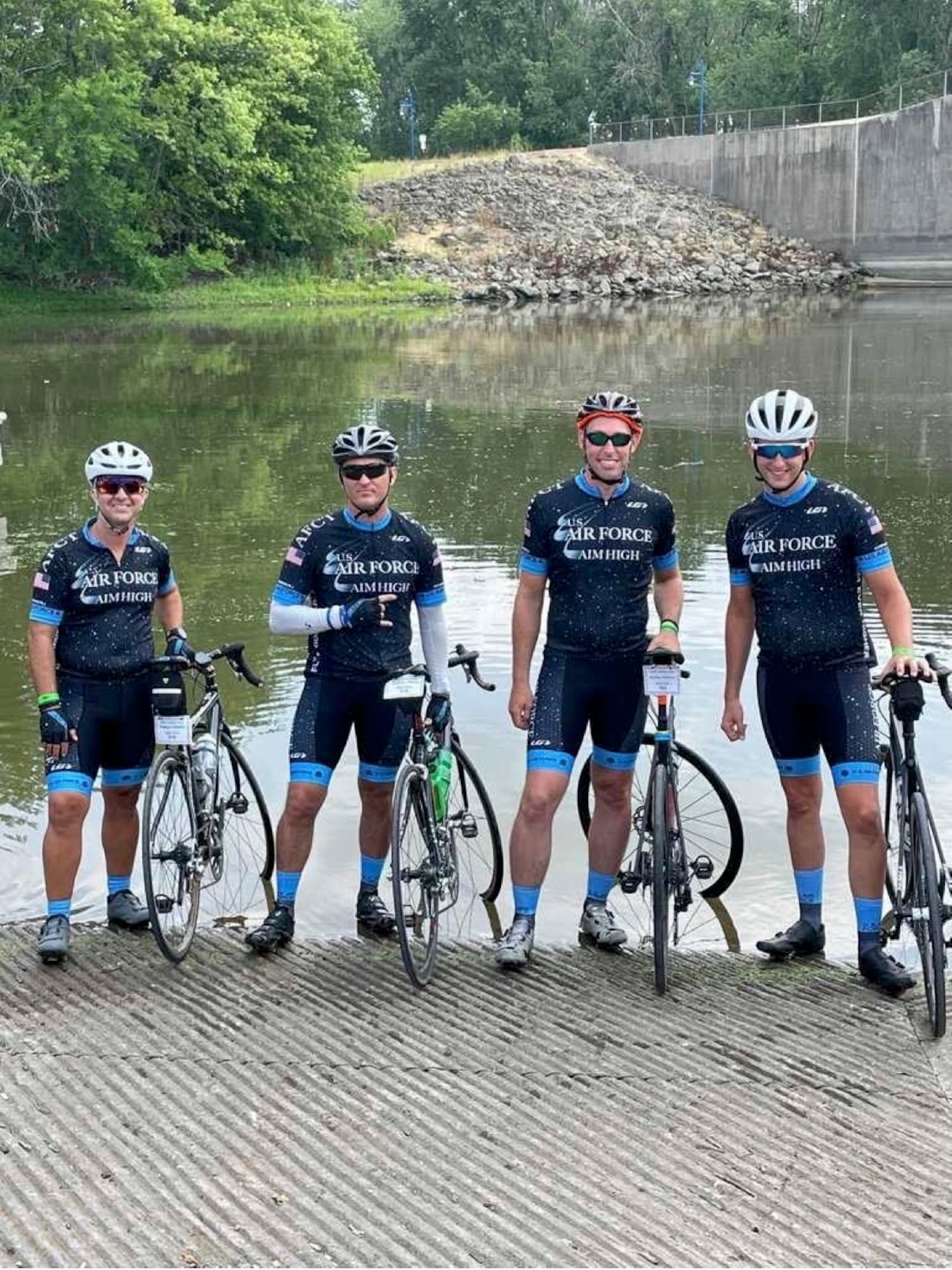 Photo of an Air Force Cycling Team member standing with other AFCT cyclists in Iowa.