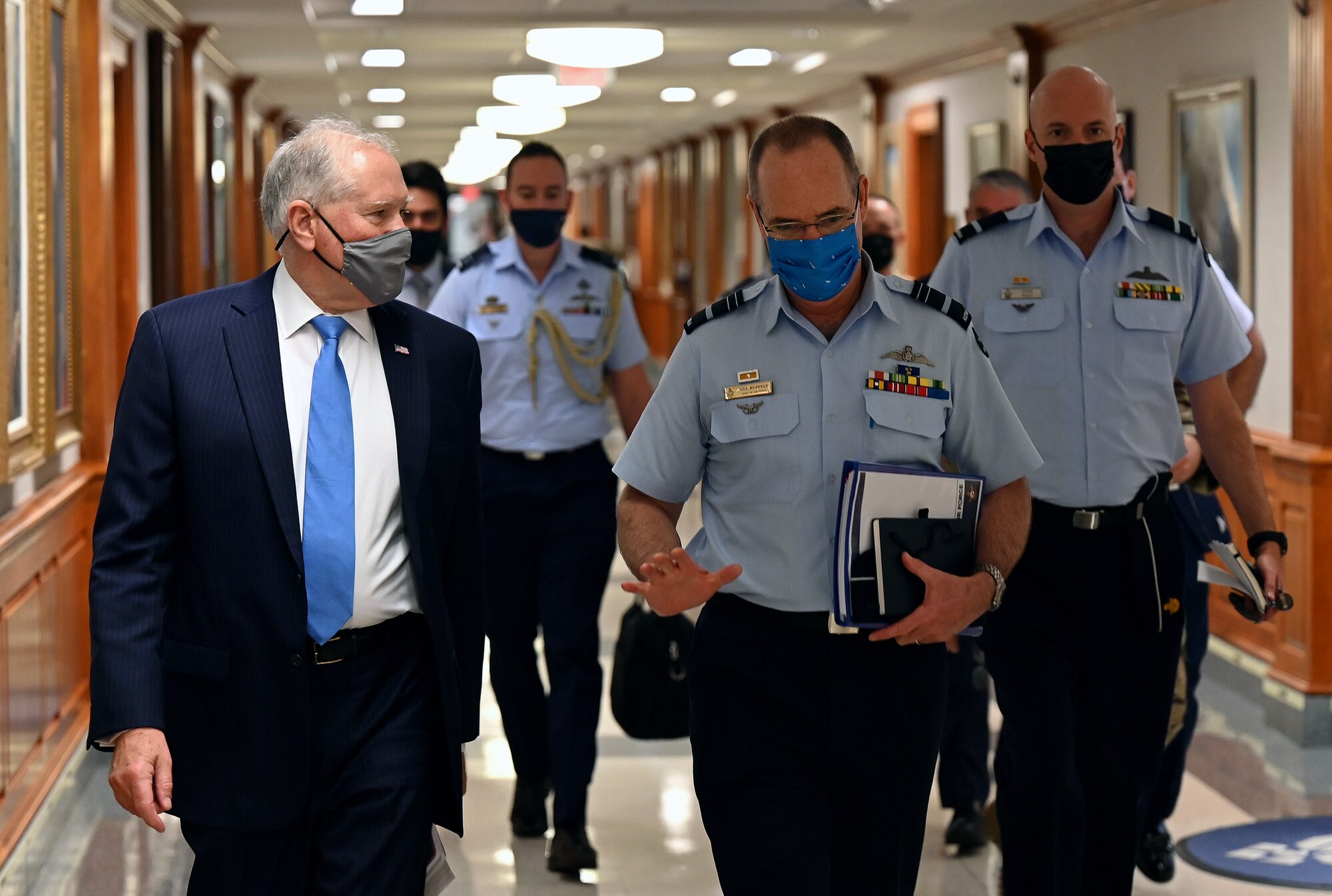 Secretary of the Air Force Frank Kendall walks with Air Marshal Melvin Hupfeld